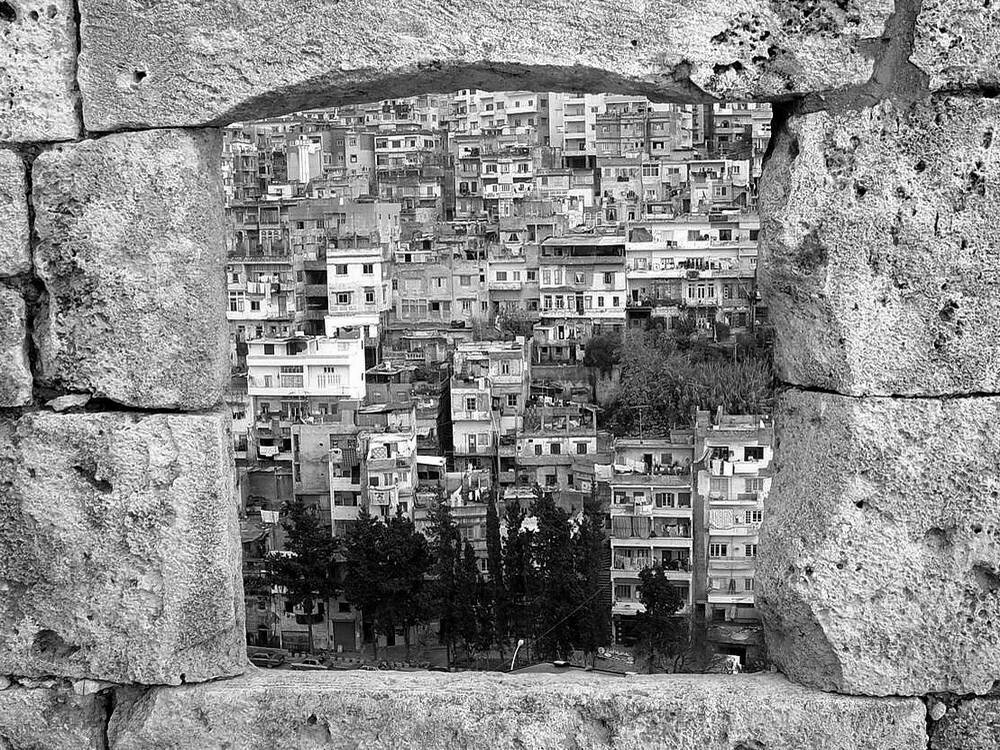A window at the eastern facade overlooking the Qobbeh District.