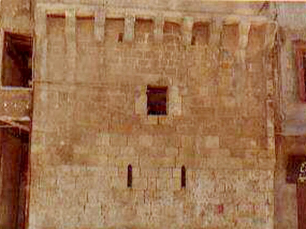 A small defensive tower outside the western portal of the Mansouri Great Mosque.